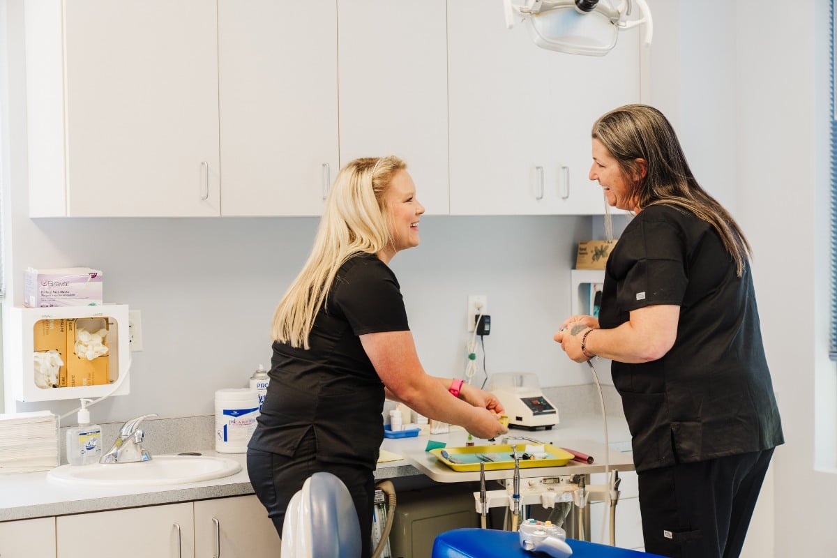 Dental team preparing for a patient’s first visit at Wilmington Pediatric Dentistry.