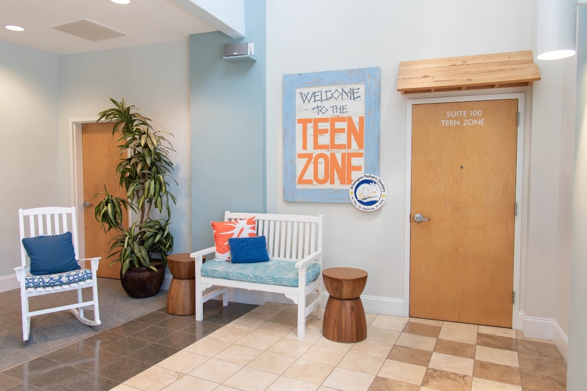 Waiting area with “Teen Zone” sign inside Wilmington Pediatric Dentistry